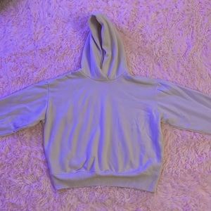 Plain cream colored hoodie. No pockets. No strings.